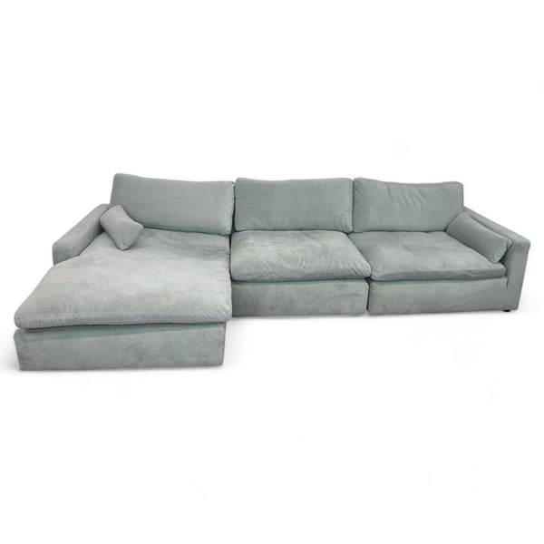 1. "Sophie Sectional with Chaise by Ashley Furniture, featuring velvet upholstery in a light gray hue, shown in a studio setting."