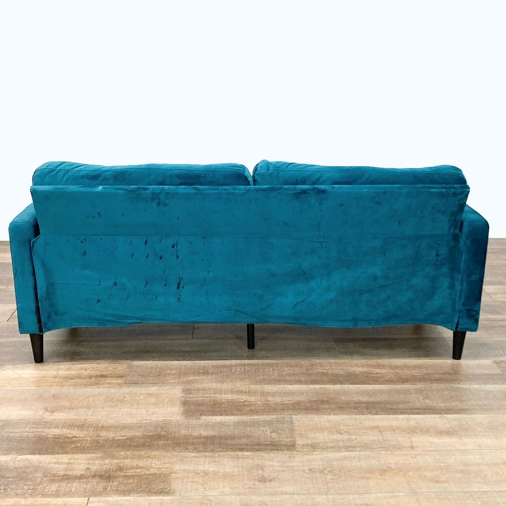 3. Rear view of the Winston Loveseat, featuring the sturdy wooden frame and teal velvet fabric.