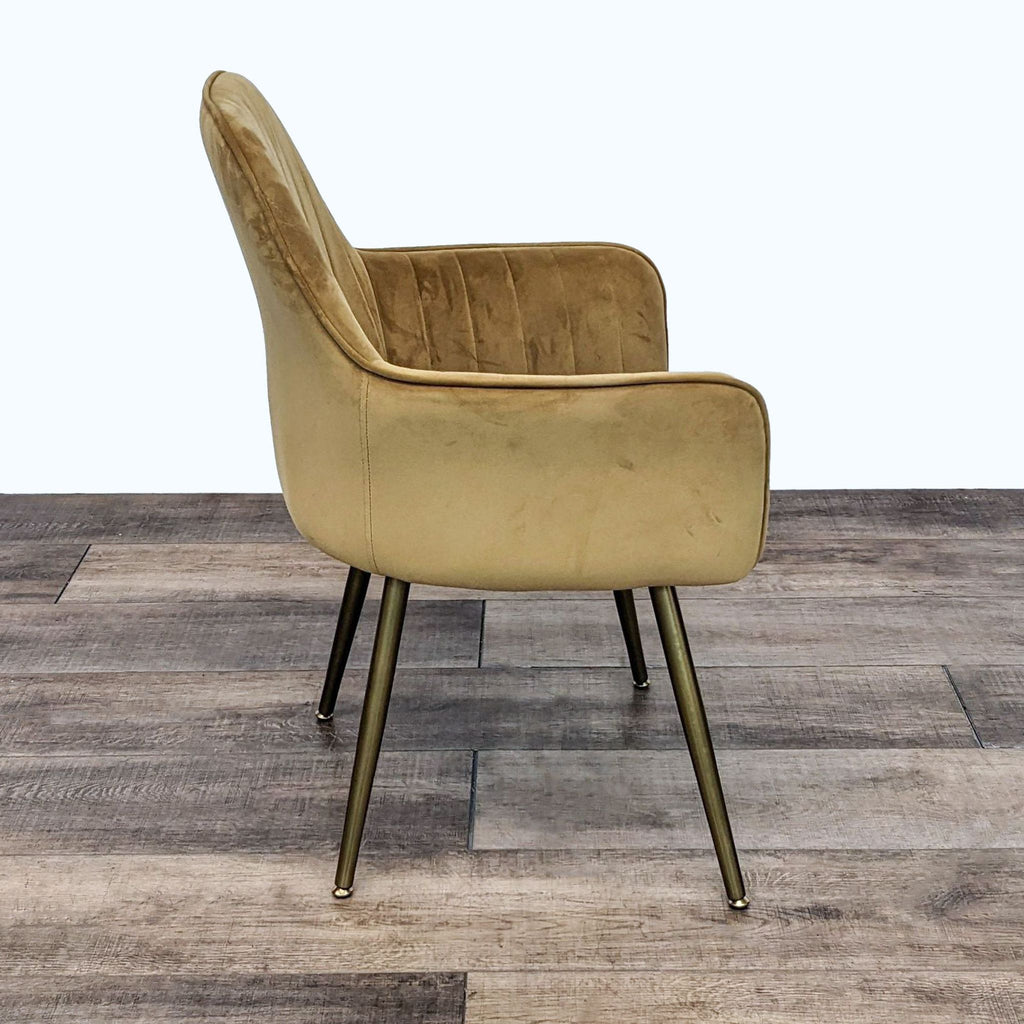 Velvet upholstered dining chair by Reperch featuring a Mid-Century design, tapered legs, and channel tufting in a side view.