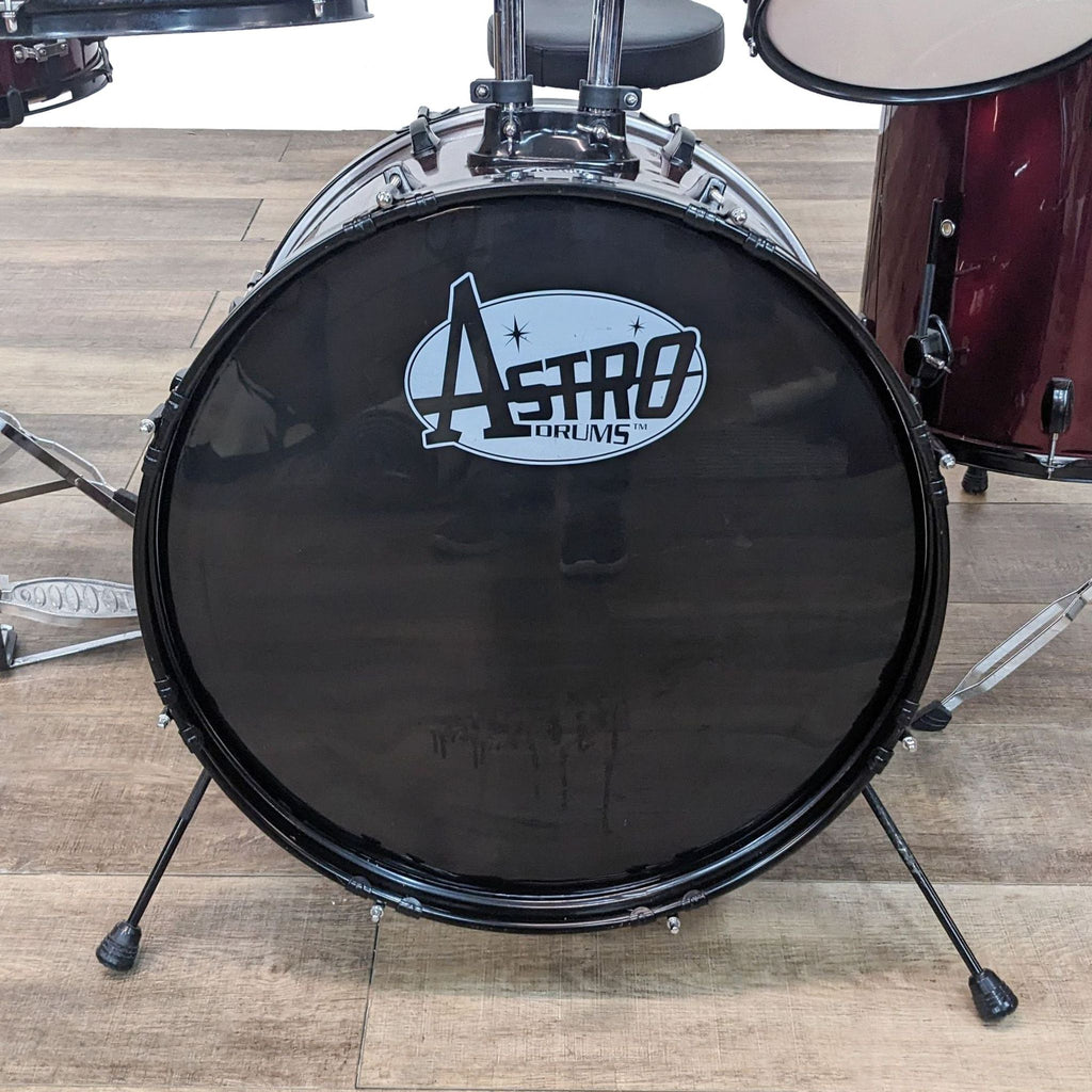 2. Close-up of an Astro Drums bass drum with the brand logo, showcasing the drum's foot pedal mechanism.