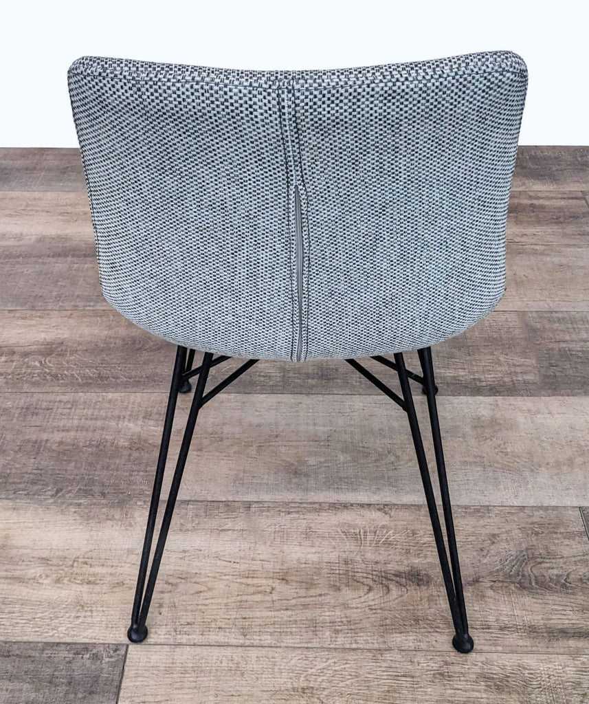 Back view of Euro Style Alisa Side Chair showcasing the grey fabric cover and supportive back design.