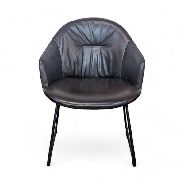 1. Article brand contemporary lounge chair with a black metal frame and dark leather cushioning, ruched back detail.