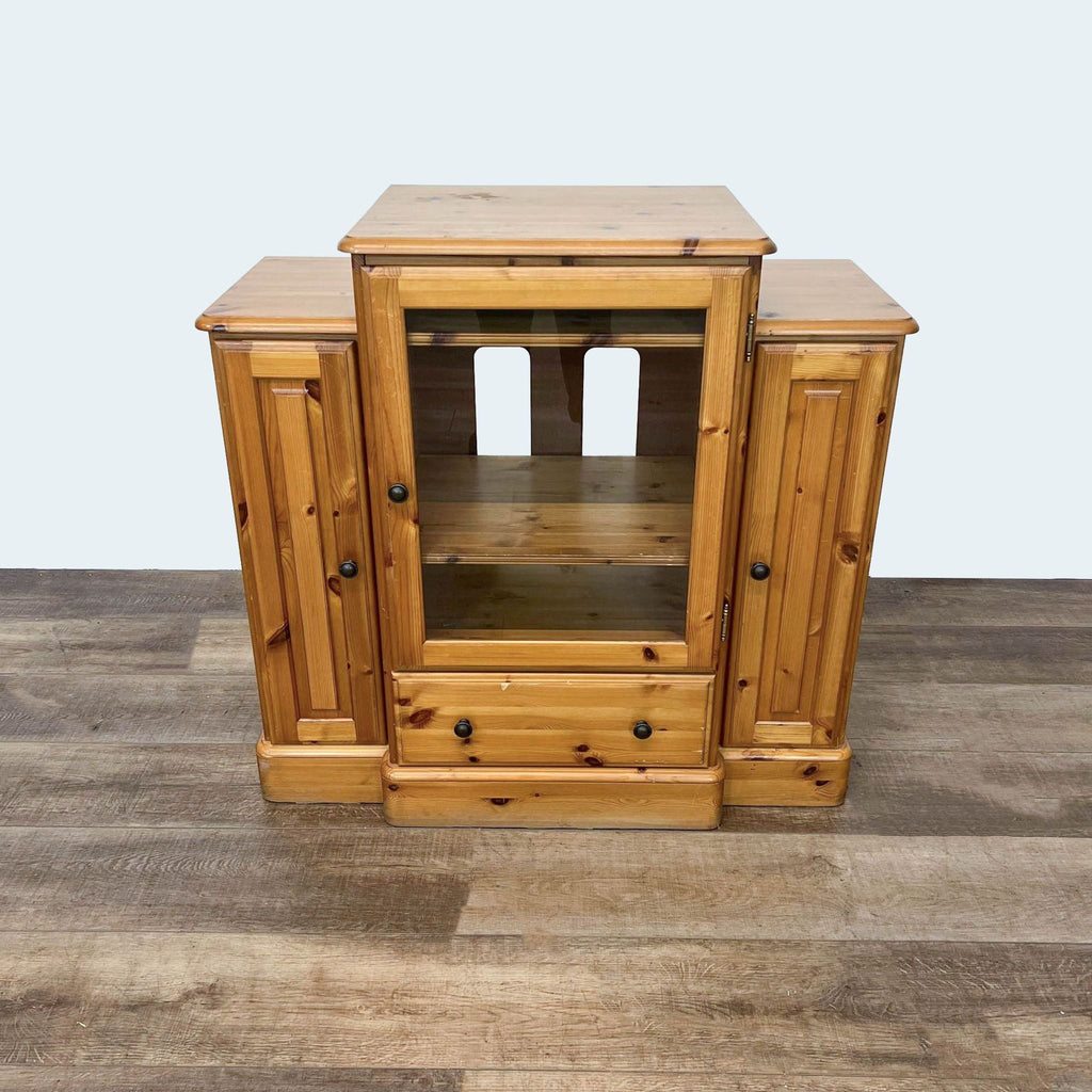 Pine cabinet by Ducal Furniture with multiple compartments.