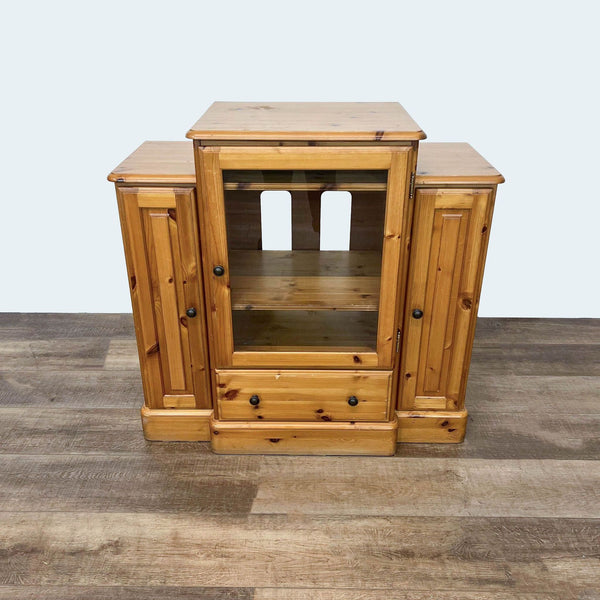 Pine cabinet by Ducal Furniture with multiple compartments.