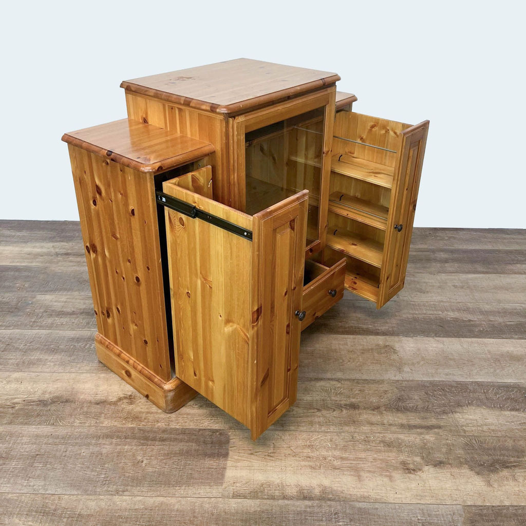 Ducal Furniture cabinet in pine with open doors revealing shelves.