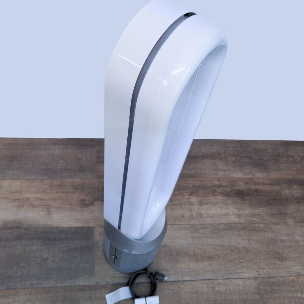 A side view of a bladeless Dyson tower fan, demonstrating its curvature, safe design, and easy-to-clean surface.