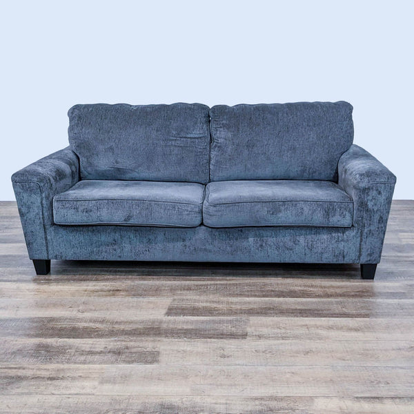 Ashley Furniture Abinger loveseat with plush cushioning and chenille fabric, front view on a wooden floor.
