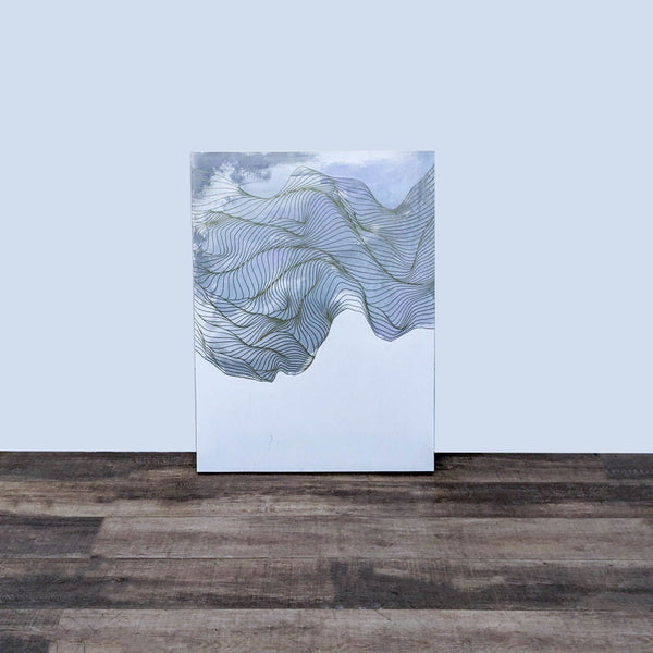 "Tracie Cheng's abstract 'As The Day Fades' artwork, with undulating lines on a square wood panel, displayed on a wooden floor."