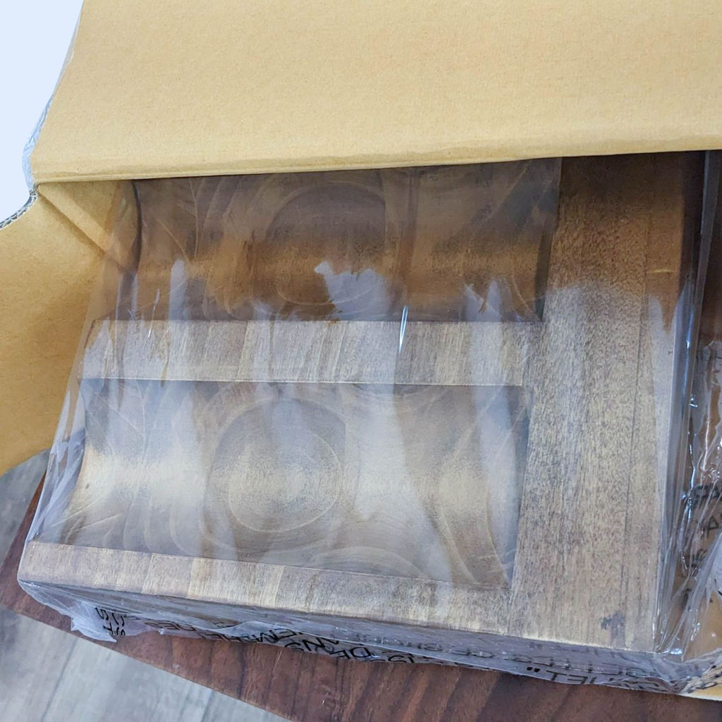2. Open cardboard box revealing packaged meranti wooden wine glass shelf with rustic finish.