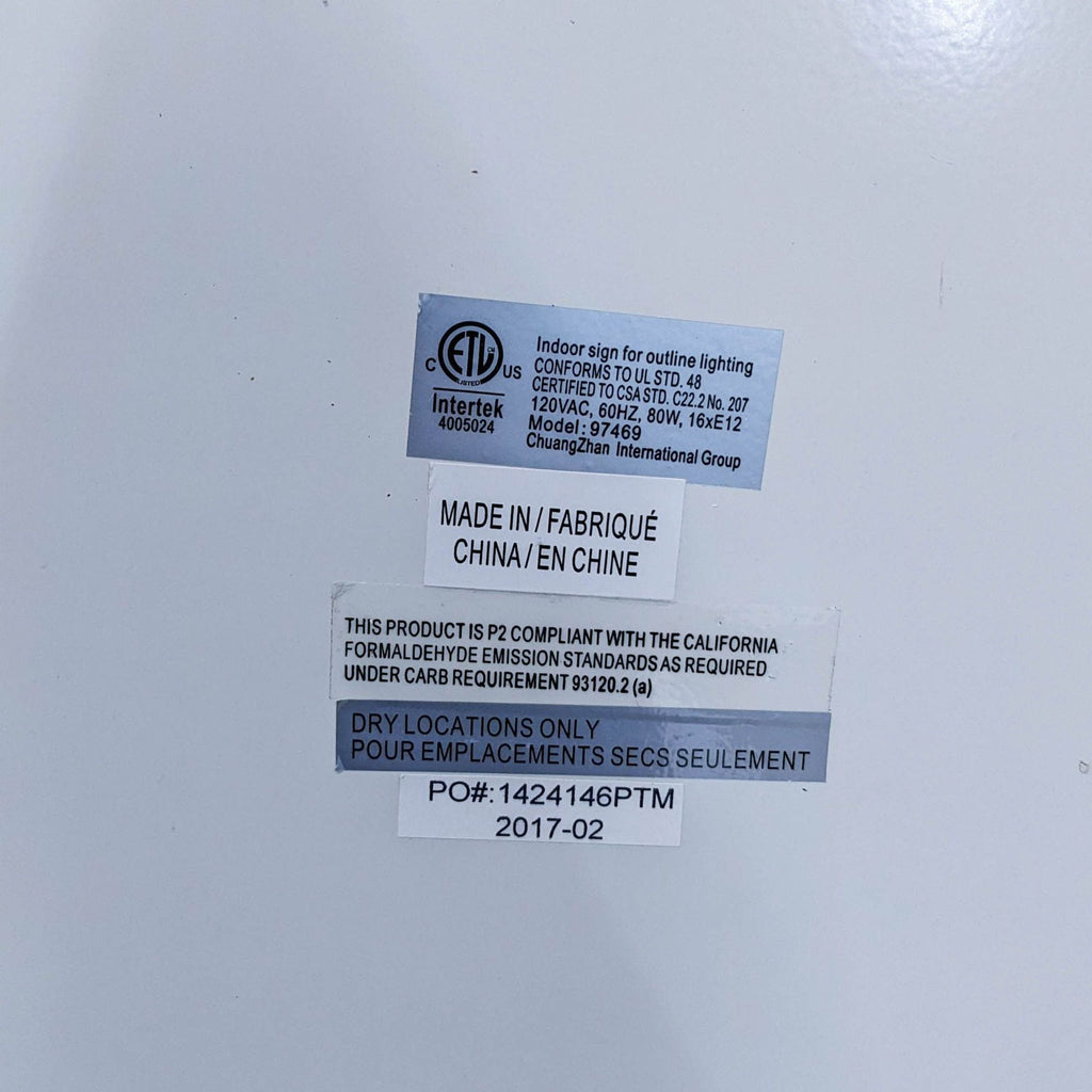 Close-up of the back label on the Hannah mirror by Pottery Barn Teen, detailing compliance and manufacturing information.
