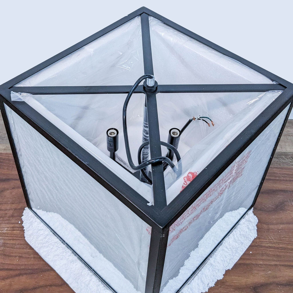Top view of Reperch light fixture, showing wiring and frame.