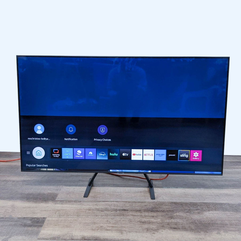 2. A modern Samsung television displaying a smart TV interface with various streaming service apps available, hinting at comprehensive entertainment options.