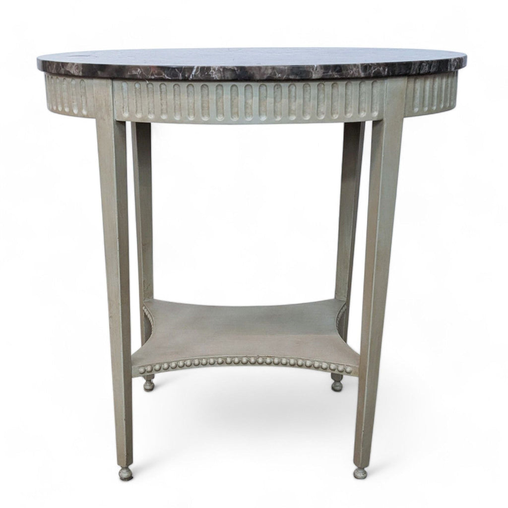 Classic Reperch end table with marble surface and decorative nailhead trim on a neutral backdrop. 