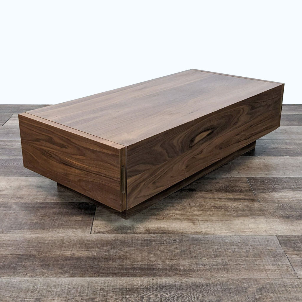 Contemporary EQ3 coffee table showcasing the closed hidden storage in a sleek walnut finish.