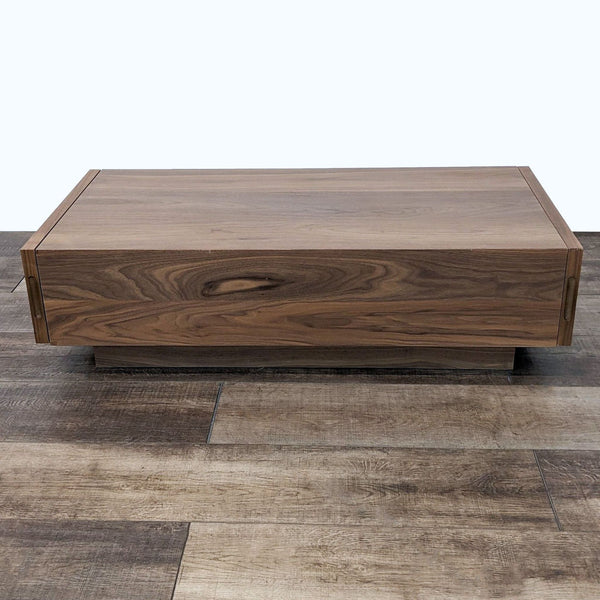 EQ3 walnut coffee table with hidden storage, particle board construction, black drawer glides closed.