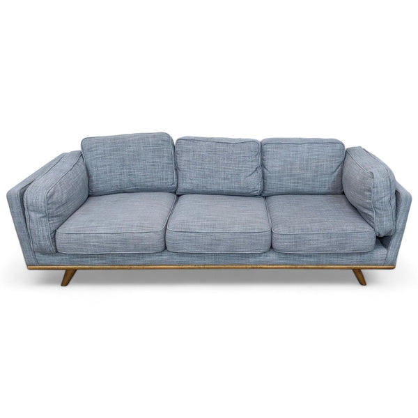 Article brand Mid-Century Modern 3-seat sofa with light blue linen fabric and wooden frame, isolated on white.