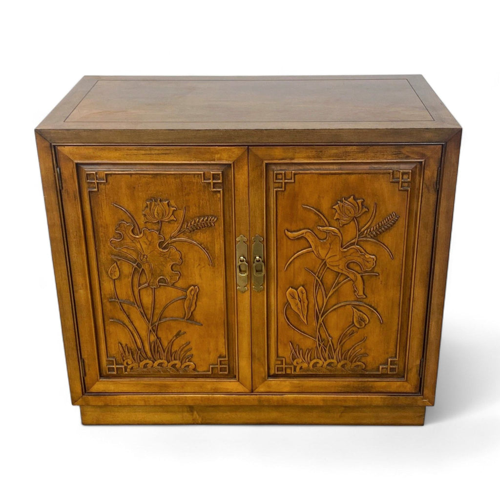 Henredon sideboard with carved floral door details and brass hardware, featuring a flat top and plinth base.