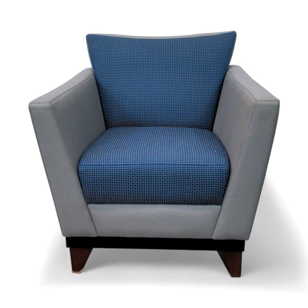 1. "Arcadia Chair Co.'s Huddle lounge chair with a blue patterned seat, gray sides, and wood legs on a white background."