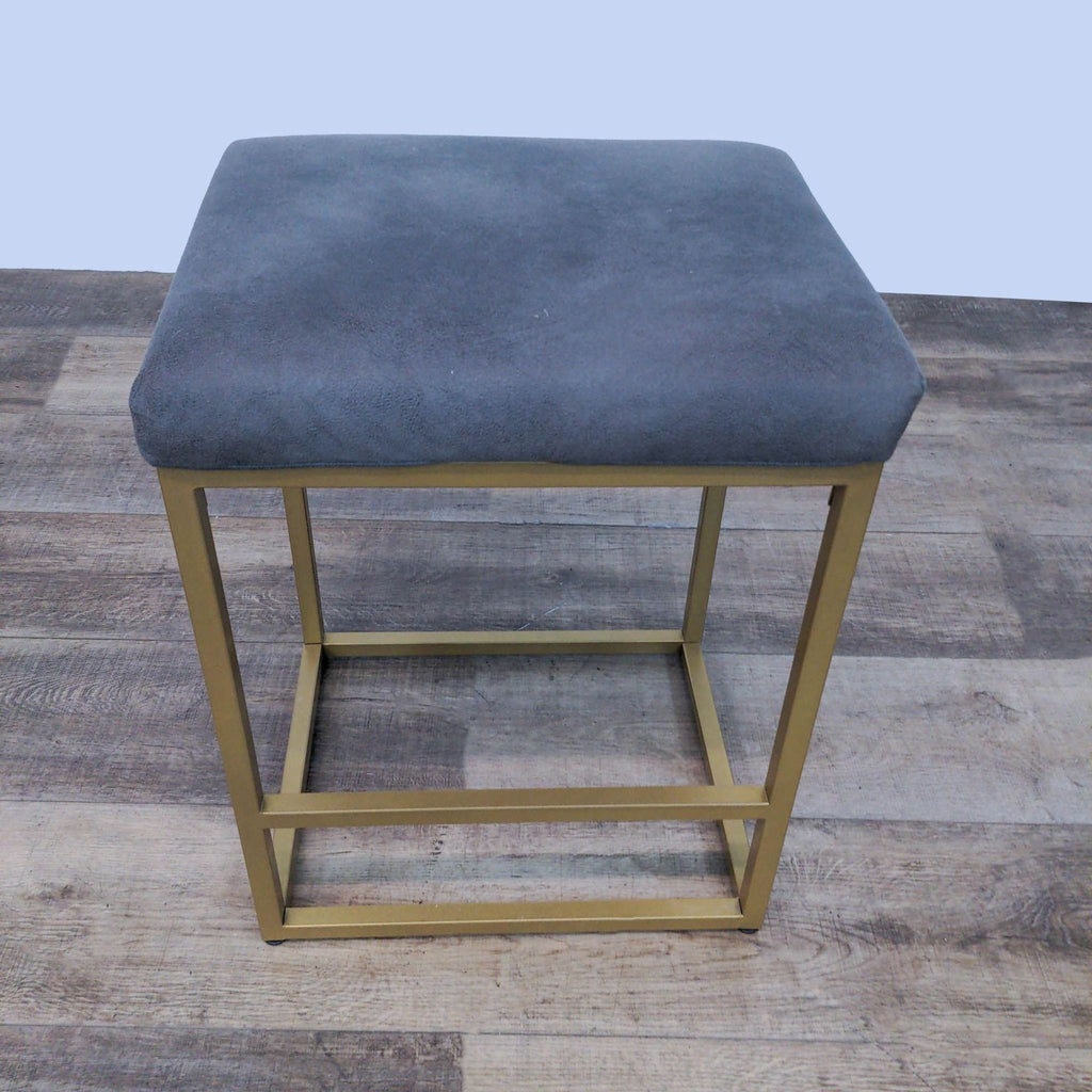 Elegant grey seat, backless, on a geometric gold metal base from Reperch's stools, ottomans & benches category.
