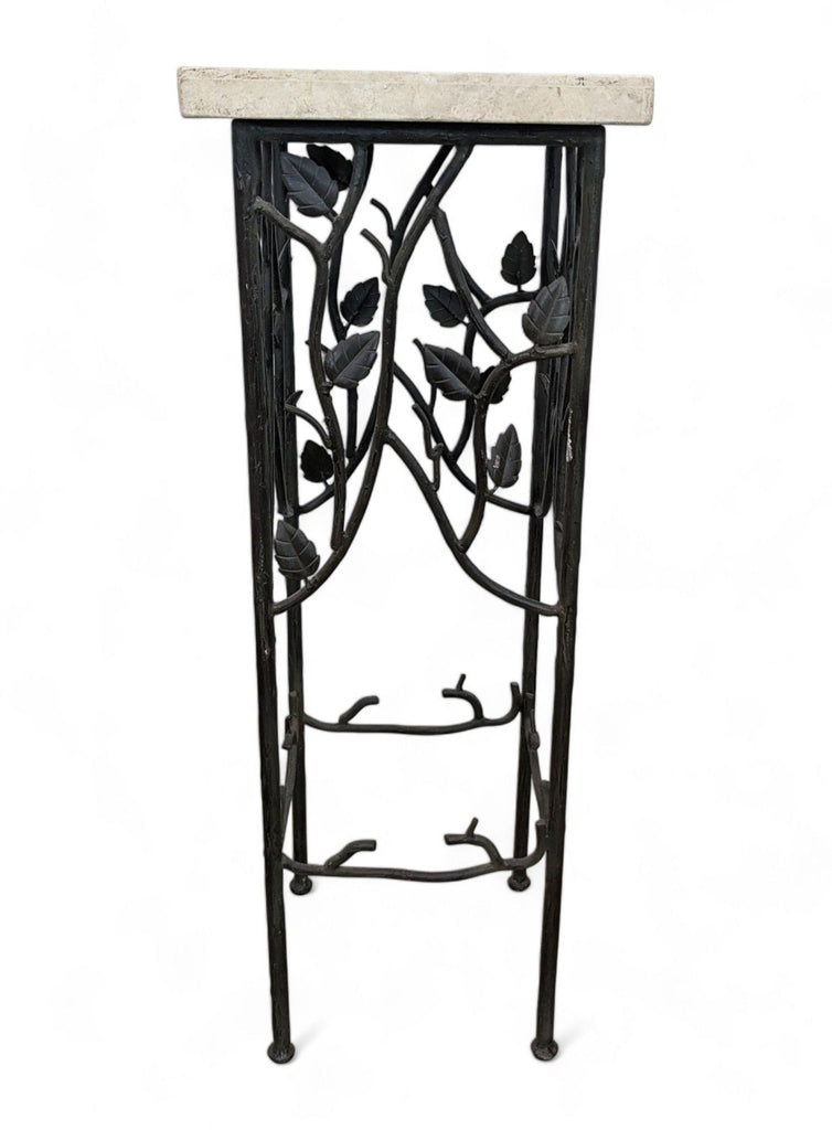 2. Elevated view of a Reperch rectangular table with leaf-patterned wrought iron base and marble surface.