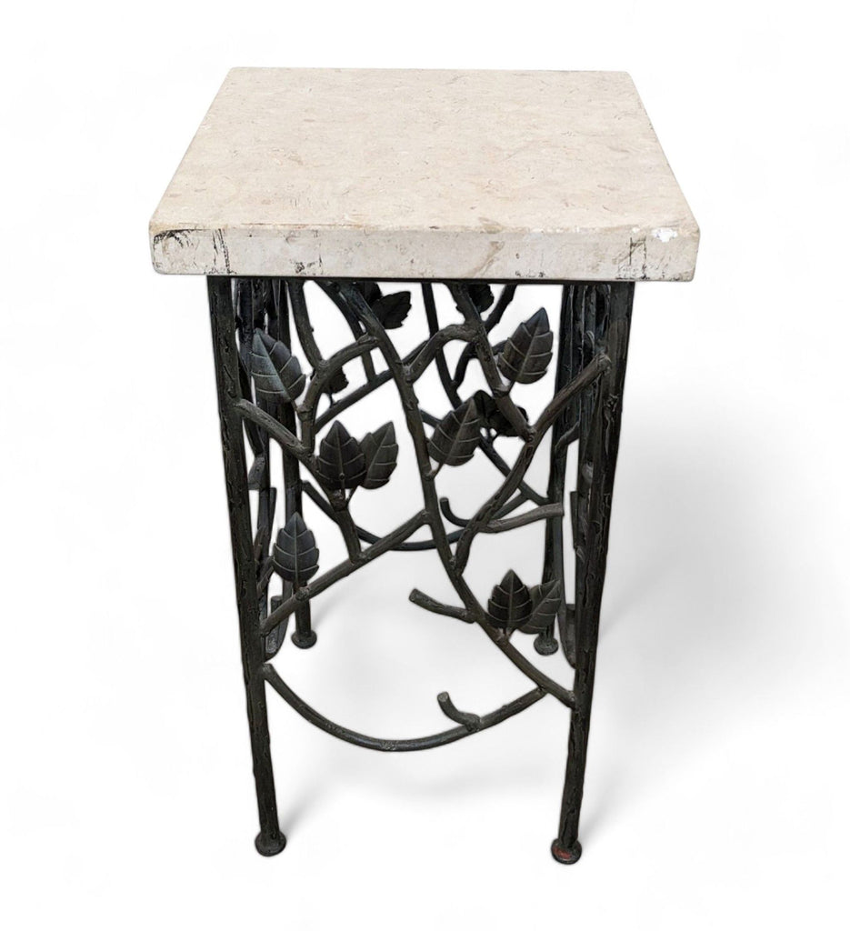 Square marble top table with a decorative wrought iron base featuring leaf designs by Reperch.