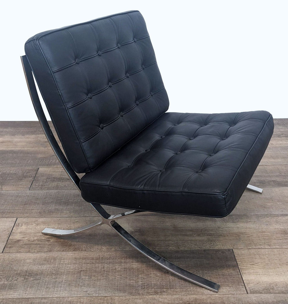 Contemporary lounge chair featuring leather cushions and sleek metal frame.