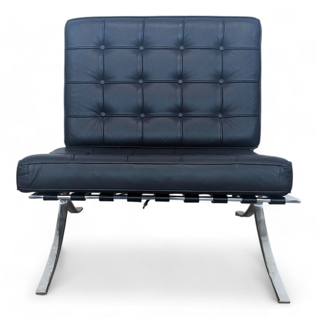Modern lounge chair with chromed metal base and tufted leather cushions.