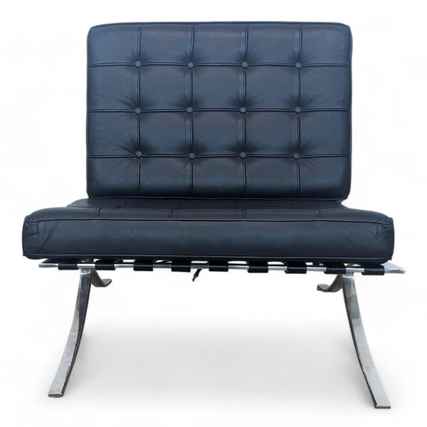 Modern lounge chair with chromed metal base and tufted leather cushions.