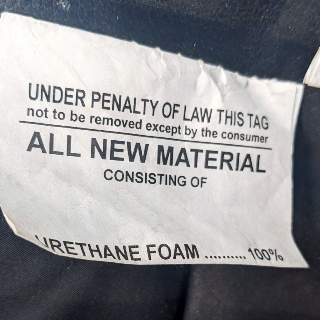 Tag indicating 100% urethane foam material on lounge chair.