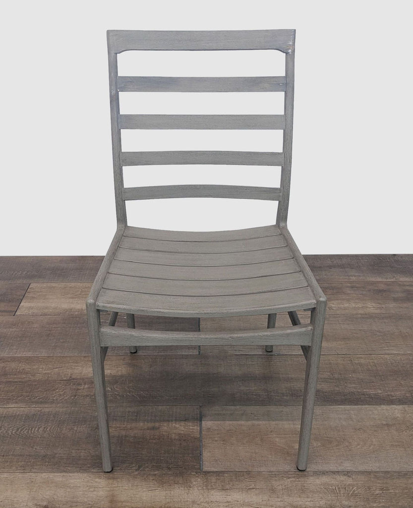 Reperch modern ladderback dining chair without cushion on a wooden floor backdrop.