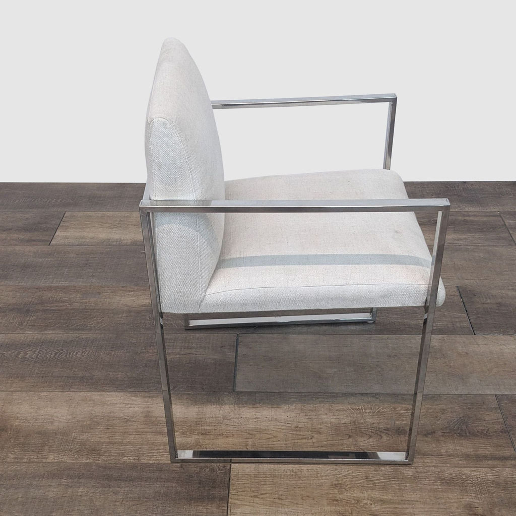 Side view of a linen-upholstered Reperch dining chair with a sleek metal frame.