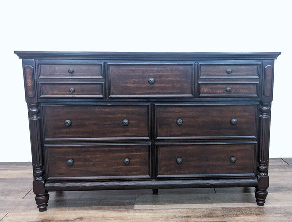 Ashley Signature Key Town 7-drawer dresser with dark bronze hardware and ash swirl accents in dark brown finish.