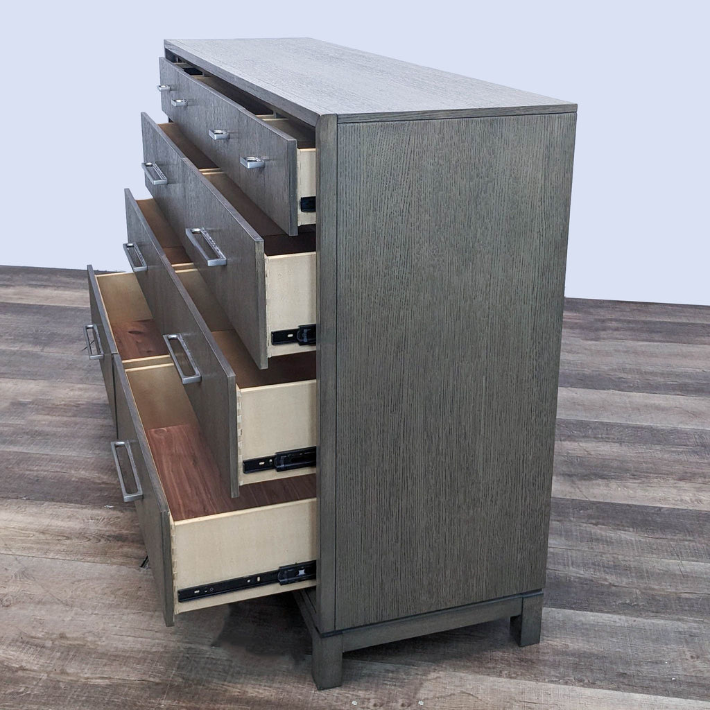 Side view of an open Rachael Ray Greige Dresser, showing drawers with cedar lining and metal glides.