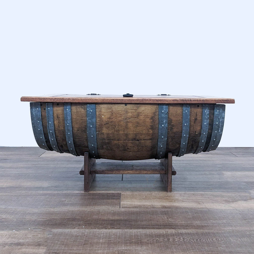 3. Front view of a closed Napa East reclaimed oak barrel coffee table with metal bands.