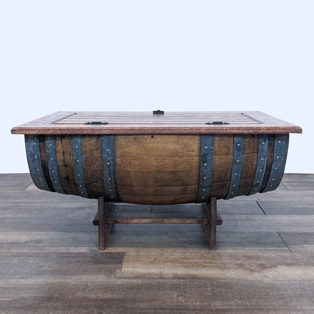 1. Napa East reclaimed oak wine barrel coffee table closed on a wood floor.