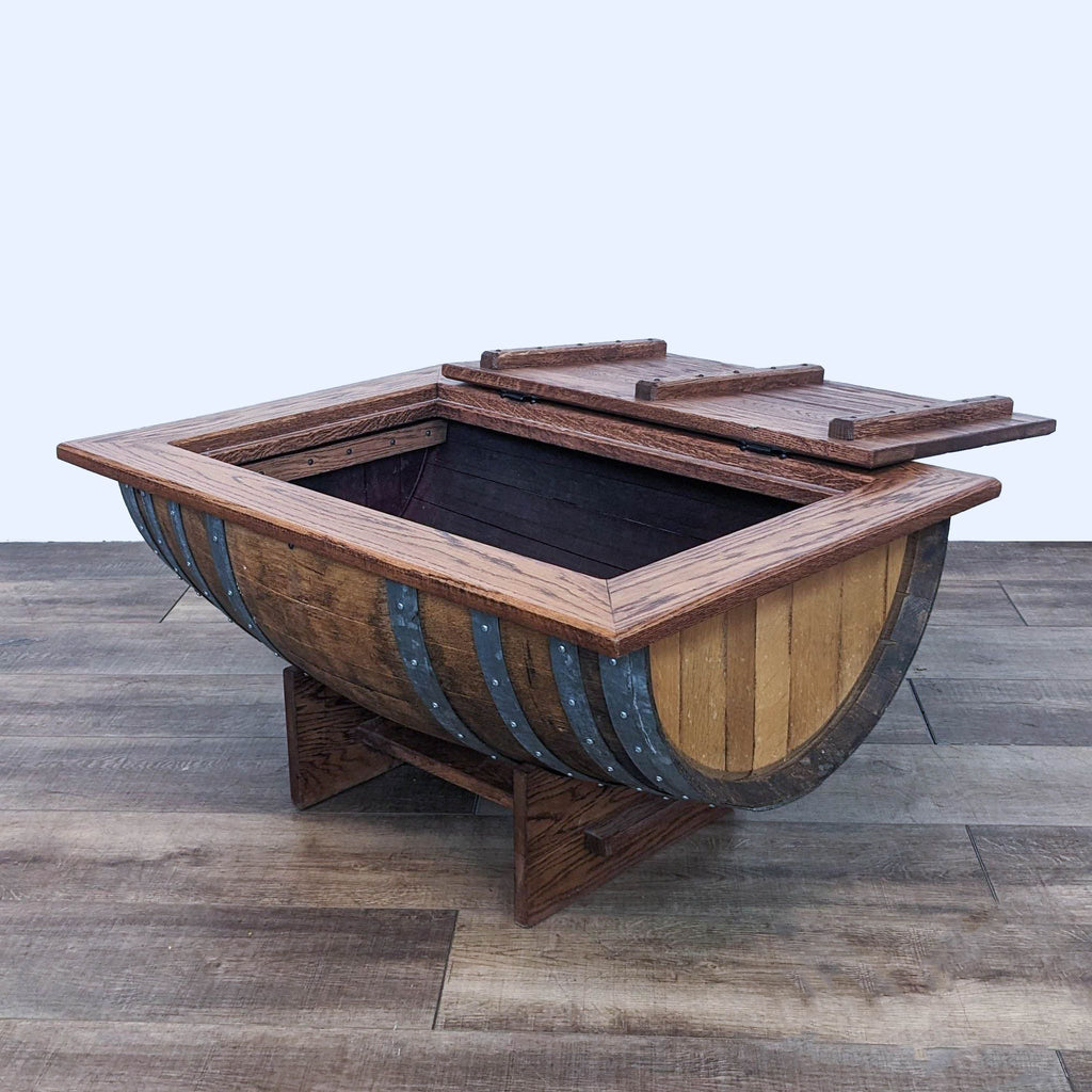 2. Opened Napa East oak wine barrel coffee table revealing storage compartment.