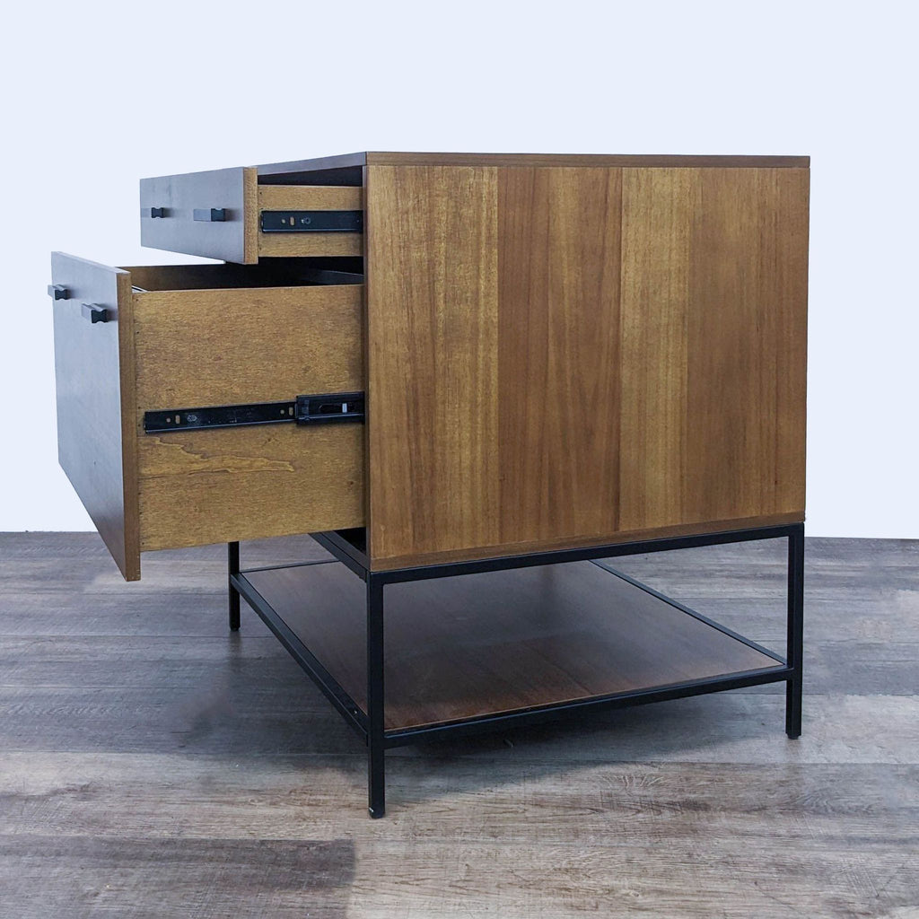 Interior view of a Hollis cabinet, open to show the two drawers on a steel frame. By Living Spaces.