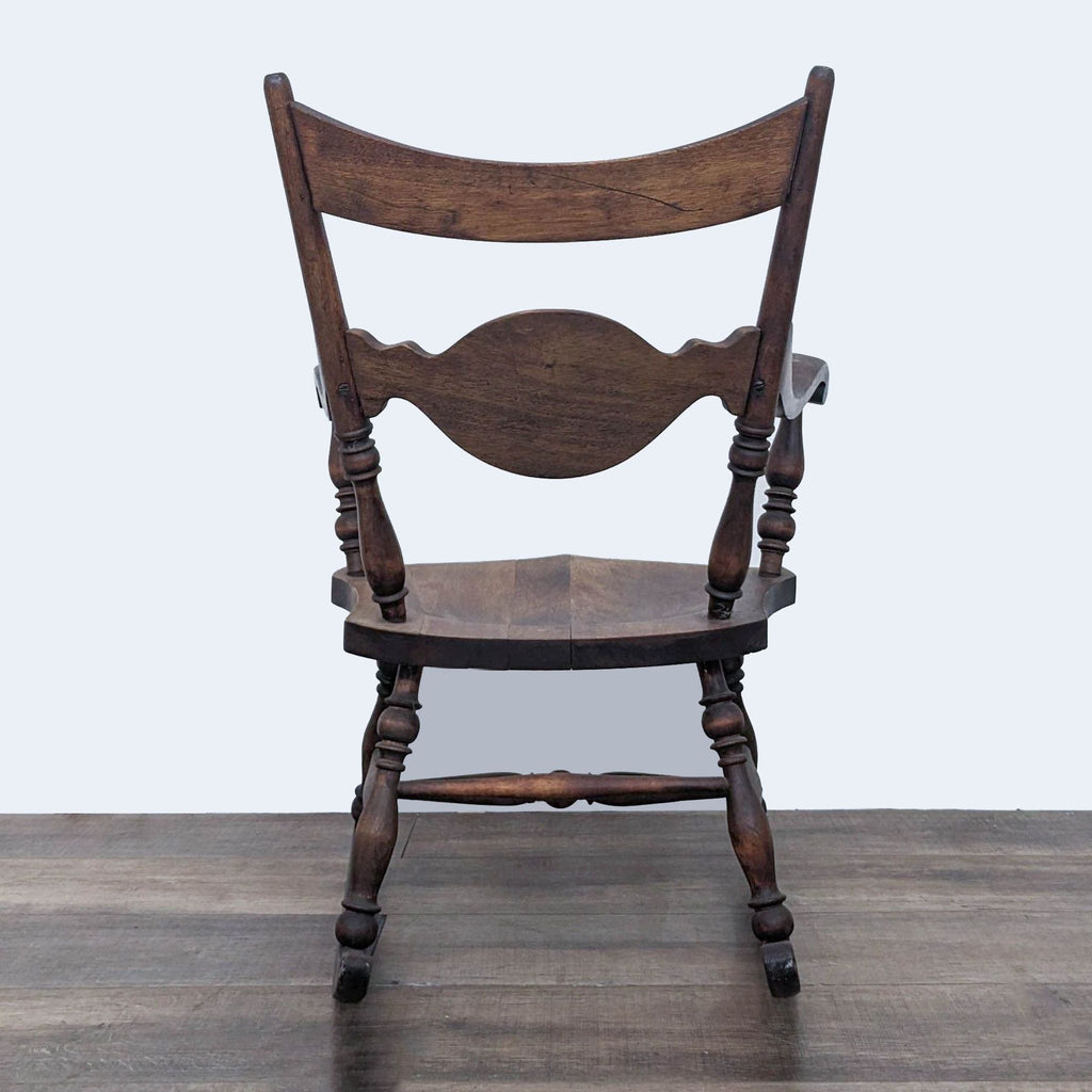 Classic Reperch rocker featuring wood inlay design on backrest, rear perspective.