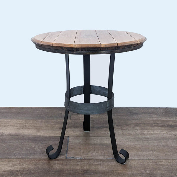 Saury brand side table with round American oak top and wrought iron legs, viewed at an angle.