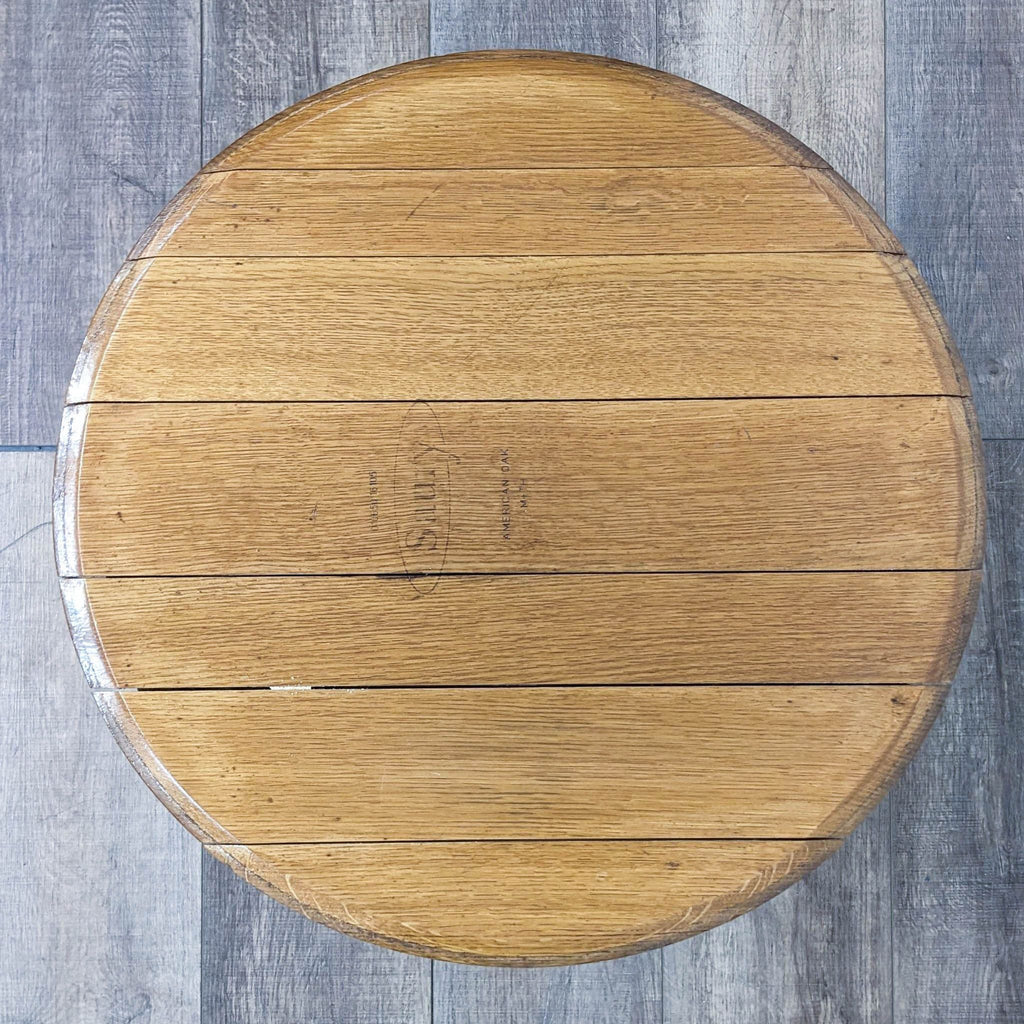 Top view of a Saury oak side table showcasing the wood texture and metal brace detail.