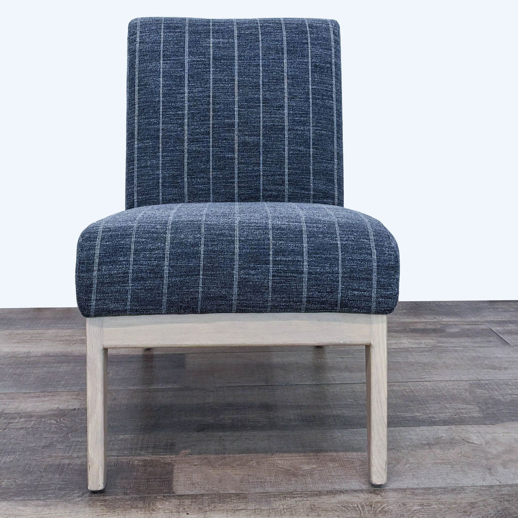 1. Front view of a Hearth and Hand lounge chair with charcoal-striped fabric and natural wooden legs.