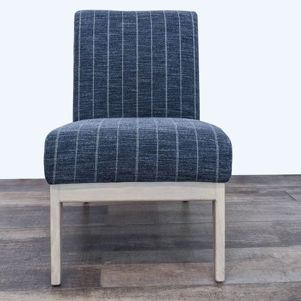 1. Front view of a Hearth and Hand lounge chair with charcoal-striped fabric and natural wooden legs.