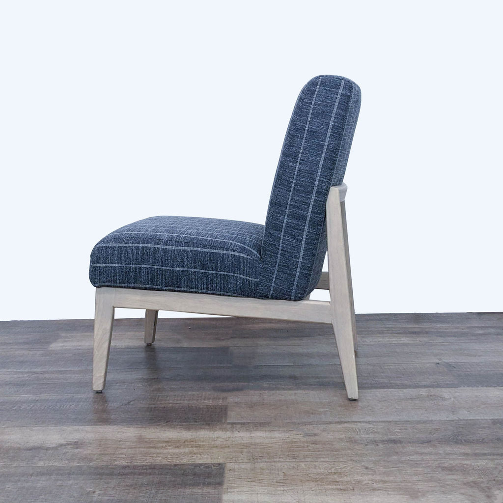3. Side view of a modern Hearth and Hand lounge chair with a sleek design and striped upholstery.