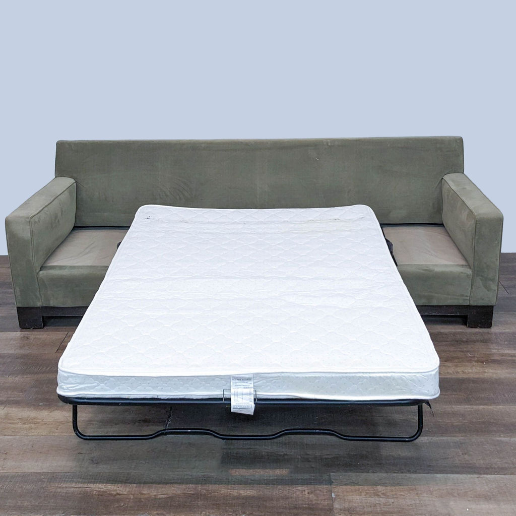 2. The same Reperch sleeper sofa shown extended into a full-size bed with a white mattress.
