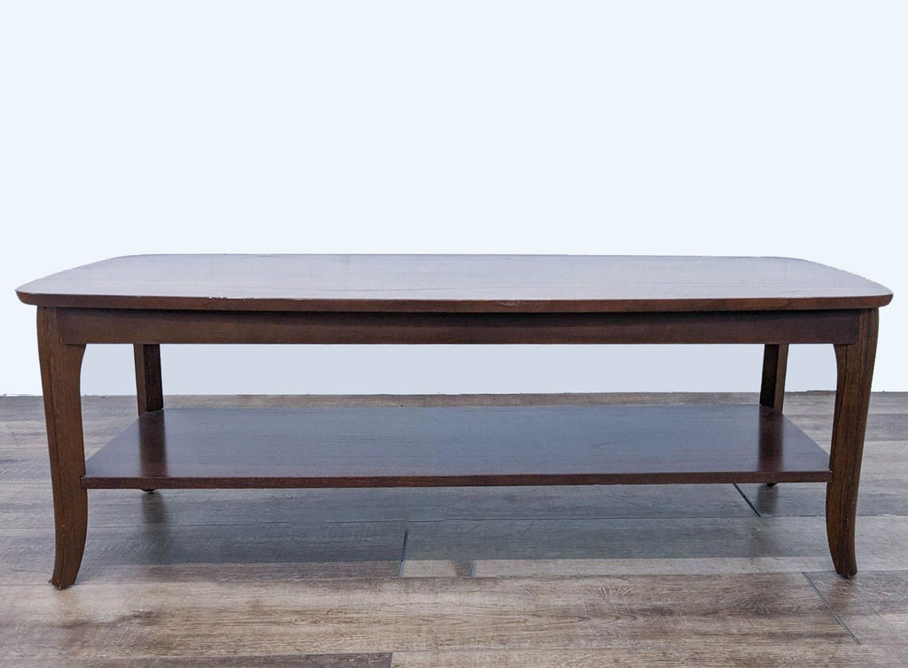 Sleek, rectangular coffee table from Reperch with an elegant design and bottom shelf. 