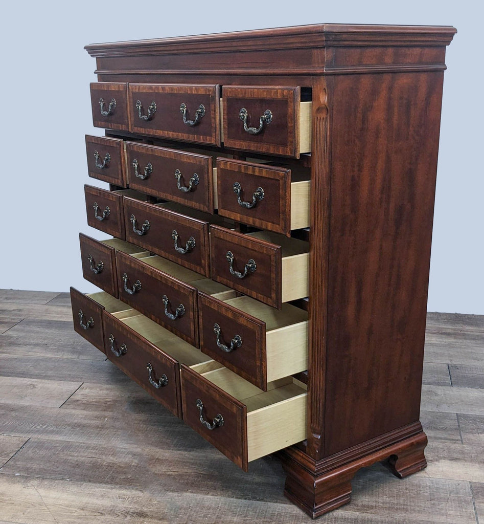 Traditional wooden veneer dresser by Reperch with open drawers showcasing interior, angled view.