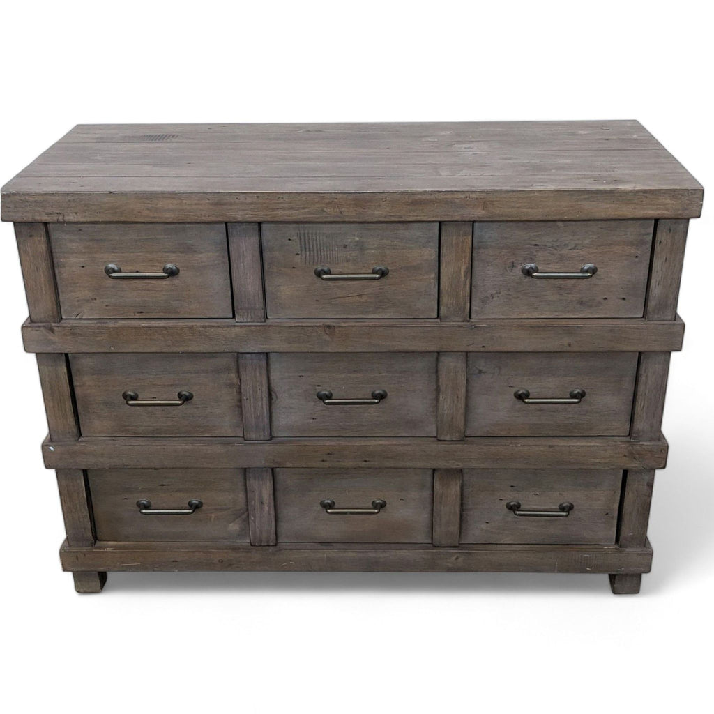 Rustic dresser with 5 drawers and metal pulls, designed by Pottery Barn Kids.