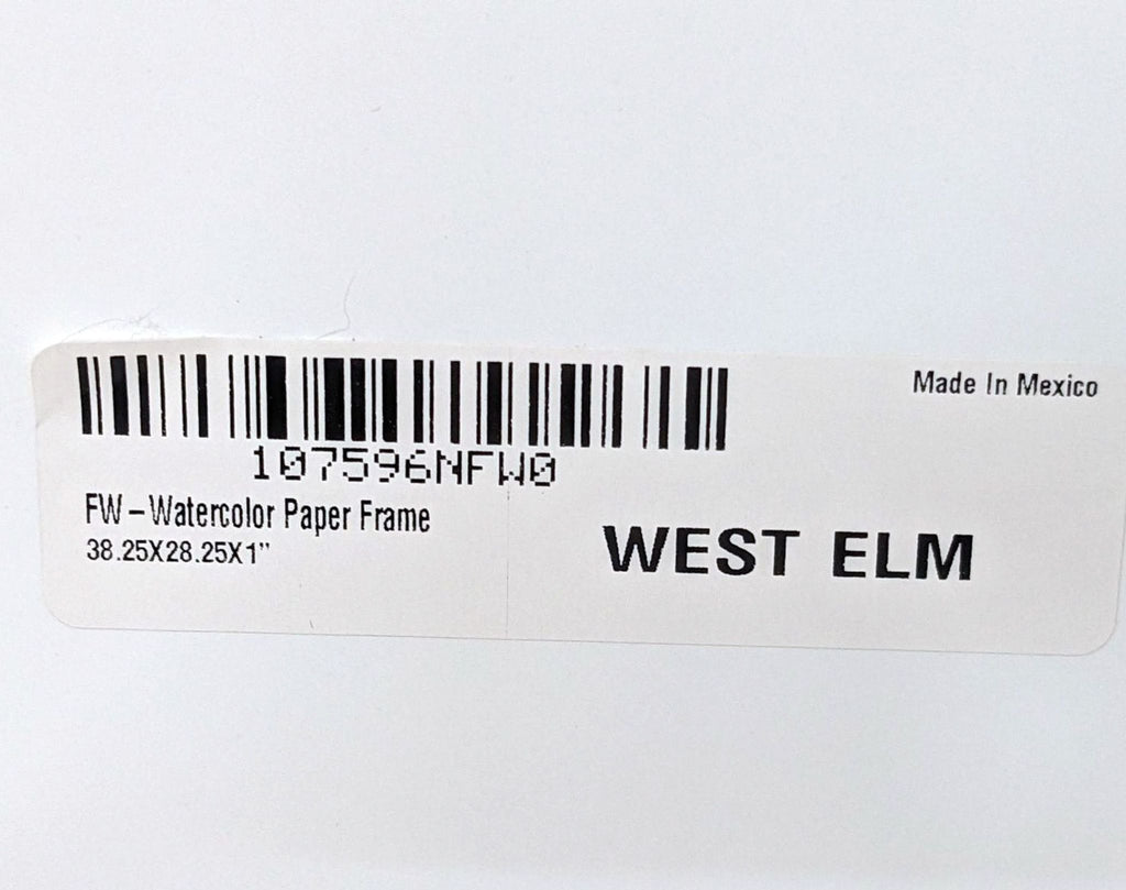 3. Close-up of a label on a framed print indicating it is a West Elm product, with dimensions and "Made In Mexico" text.