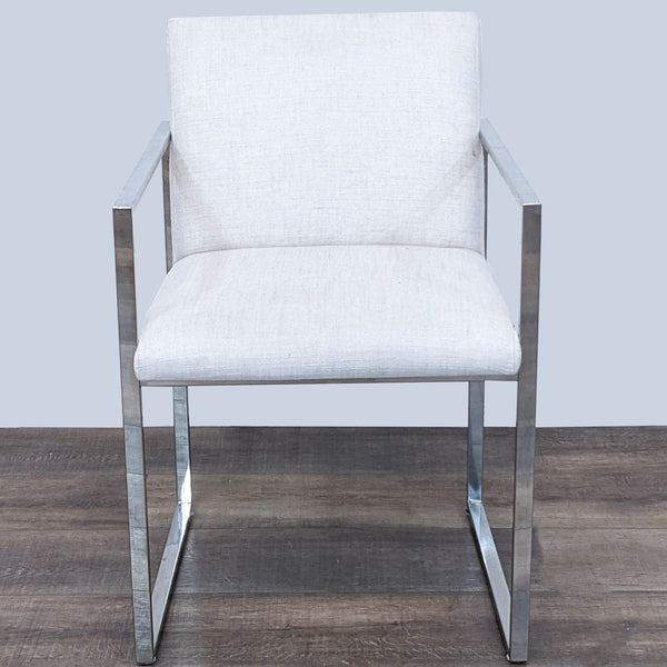 Reperch brand polished stainless steel frame dining chair with ivory linen upholstery, frontal view.