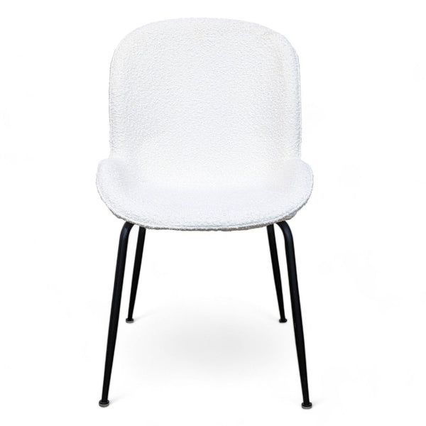 1. A Latese dining chair by Corrigan Studio with a metal frame and ivory boucle fabric on a white background.